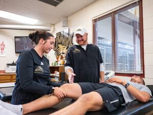 Jason Ensrud works with two NWU students.